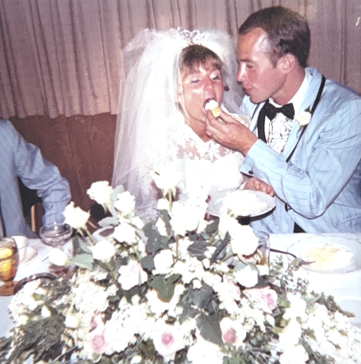 Steve feeding Wendy wedding cake